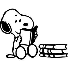 cartoon character snoopy reading a book. there is a pile of books next to him too.